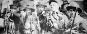 Volunteers in the GPO with a motley collection of arms.