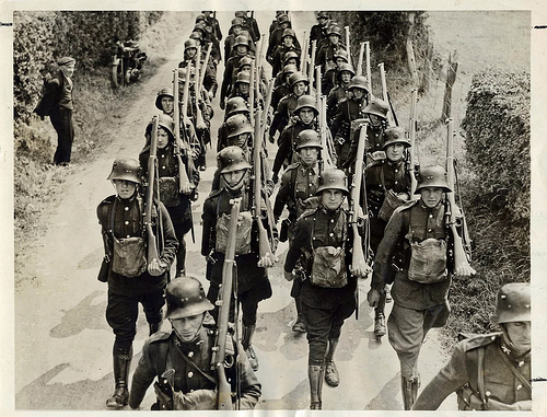 The IRish Army in 1930s German style helmets. Troops were called out to aid the Gardai in Limerick in 1935.