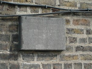 a granite plaque on the wall of the Fransiscan's Foreign Mission Office in Dublin marking the site of a hall where The Hibernian Rifles, Na Fianna Éireann and other republican groups used to hold meetings.