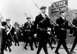 The UVF parade armed at Larne, an event that took place the same day as the suffragette's Daffodil day.