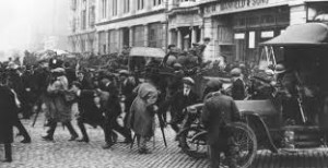 A Auxiliary patrol dismounts amid an unruly crowd in Dublin, 1921.