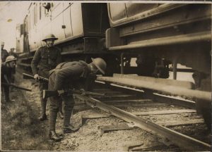 British soldiers in Kerry check under a train.