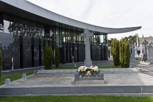 Michael Collins' grave at Glasnevin, the National Army memorial is inscribed on the low wall around the main grave.