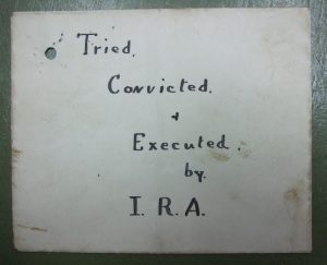 An IRA spy label attached to the body of Patrick Larmour.